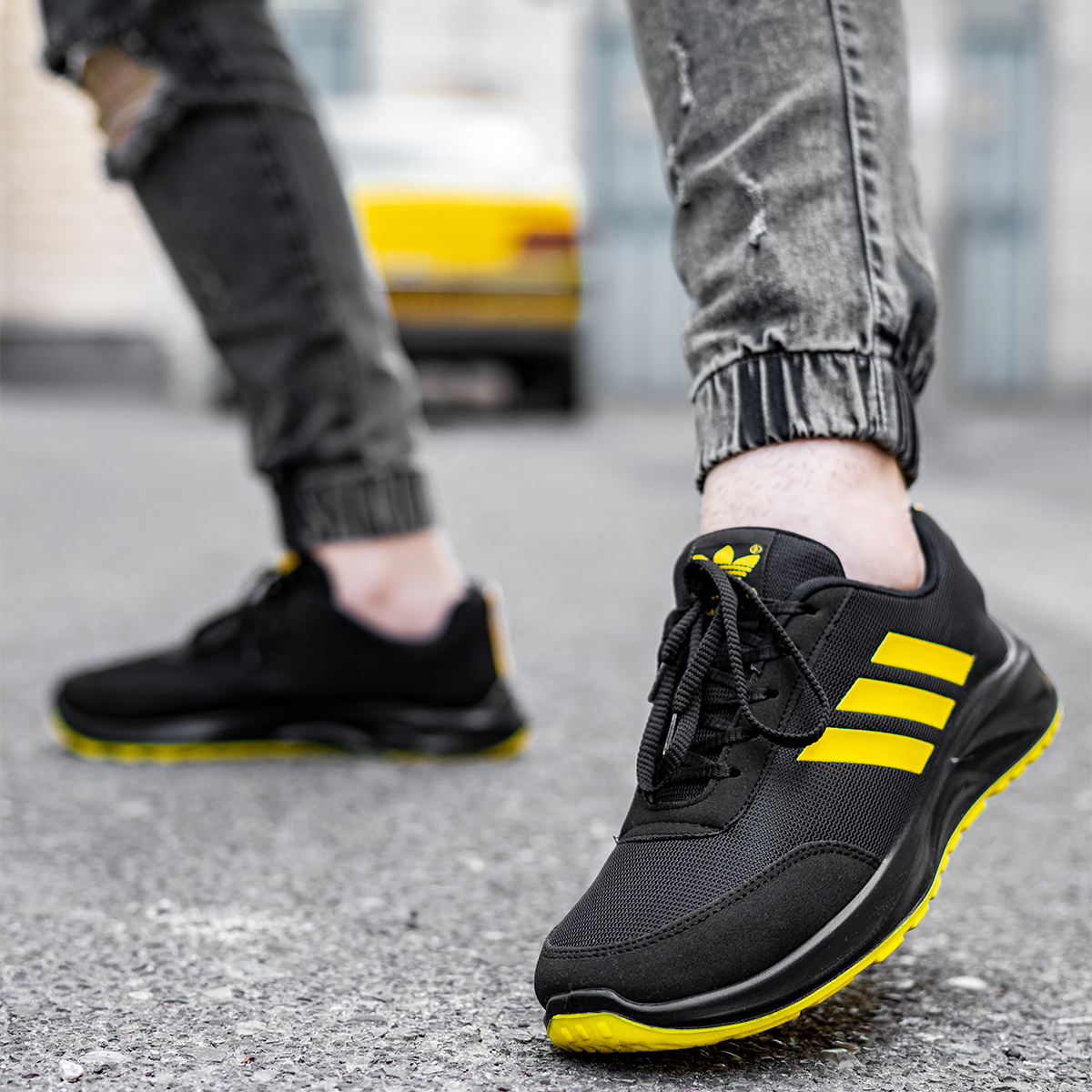 کفش ورزشی آدیداس مشکی زرد مردانه مدل Silva